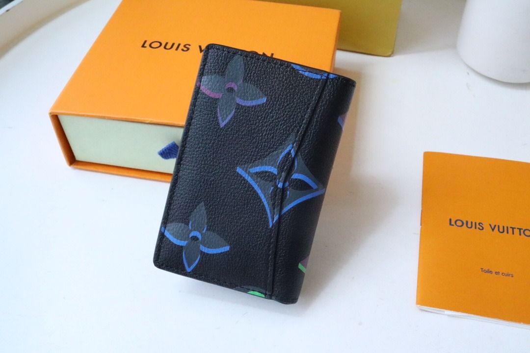 louis-vuitton pocket organizer black with blue lining. Practically unused.