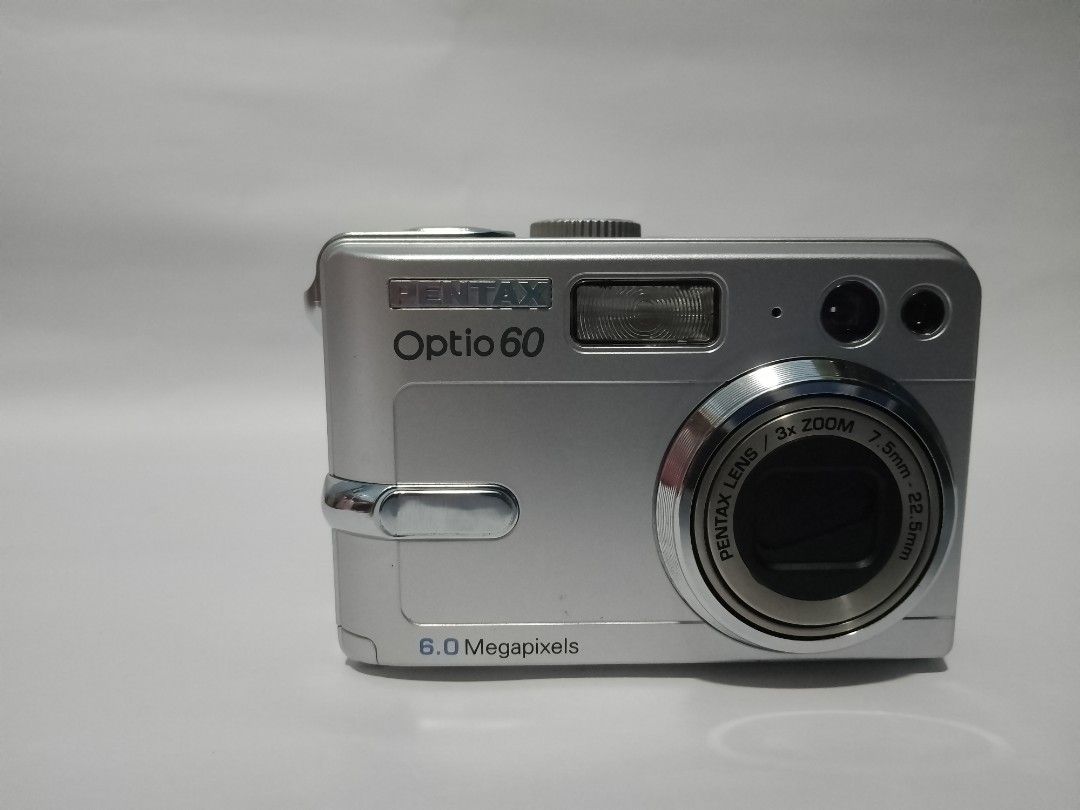 Pentax Optio60 Digital Camera (for display) (Category: Cameras) located in Quezon City. Submitted by dianaibarraajoc (Listing ID 1237084190, Image 3). Description: Pentax Optio60 Digital Camera Selling for only P750 (still negotiable) Heavily used Di na na-nagc capture, pero nag z zoom Camera is only for display or repair (lcd, and yung pang capture din) Inclusion: Pentax Optio 60 4pcs Double AA battery Camera pouch.