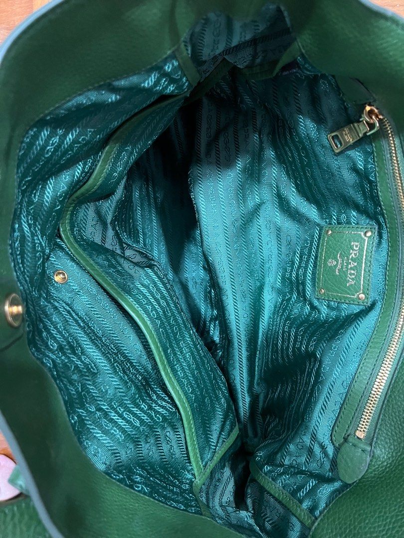 Prada Bag (Category: Bags & Wallets) located in Singapore. Submitted by Pinkflower88 (Listing ID 1237127315, Image 3). Description: Rarely use. Minor flaw at the front of the bag (see 4th pic), other than that bag condition is very new. Dust bag provided. Welcome to nego. .