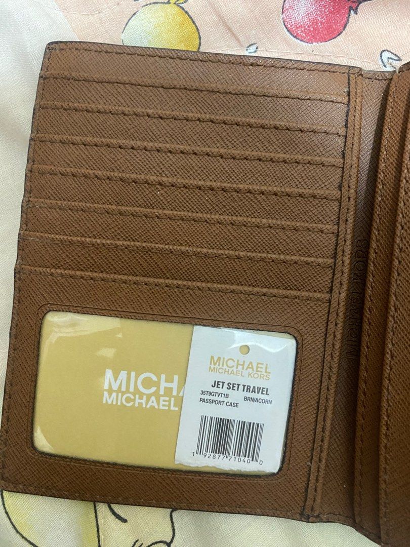Authentic MK passport holder on Carousell