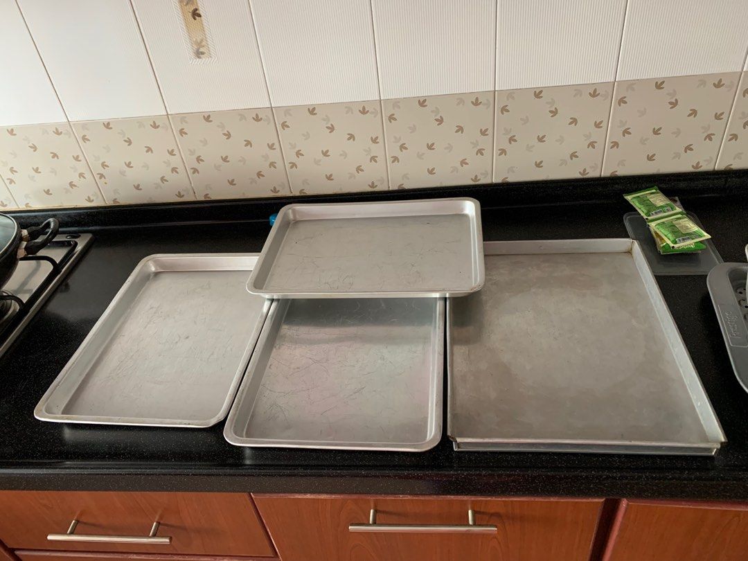 Baking trays (Category: Cookware & Accessories) located in Singapore. Submitted by nahidahb (Listing ID 1237244482, Image 2). Description: Selling all 4 trays for $35. Used once or twice a year. Too big for my new oven. The smaller ones are 16 inches x11 inches The larger one is 16 inches by 12 inches In good condition..