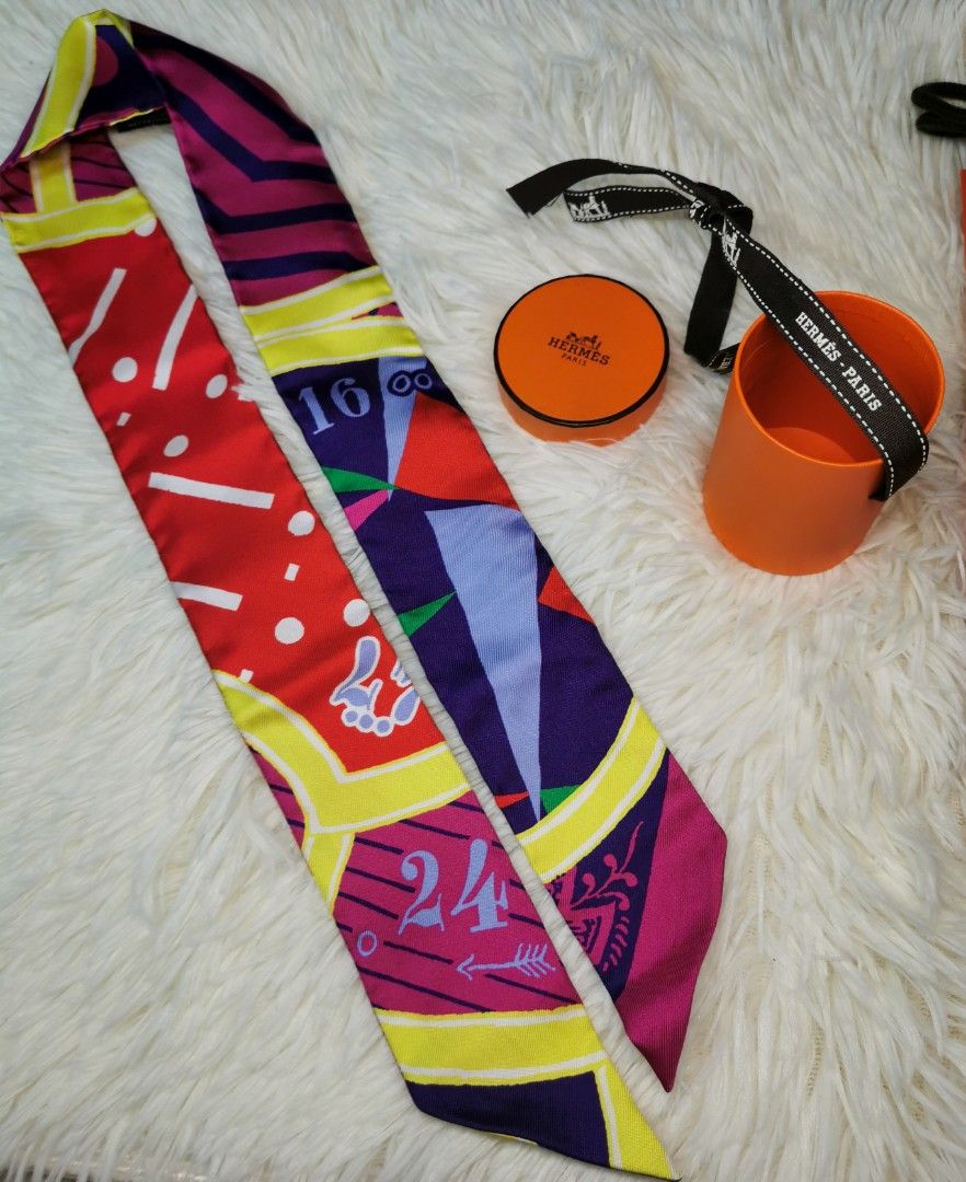Hermes Twilly Fuchsia Scarf (Category: Luxury Accessories) located in Quezon City. Submitted by noahscartonlineshop (Listing ID 1237172691, Image 2). Description: Hermes Twilly Scarf Fuchsia P13,999 💯Original Scarf in red silk twill (100%) with details in yellow, green, fuchsia, purple and white. Brand new Condition , with Box and Paper Bag . Meet up: Trinoma Mall Quezon City COP nearest LBC Branch No Free Shipping.