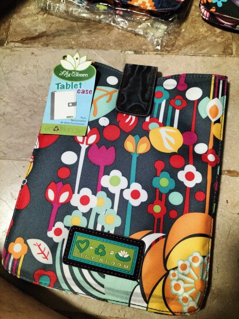 Lily Bloom Tablet Case (Category: Purses & Pouches) located in San Pedro. Submitted by adicarteu_ (Listing ID 1237263842, Image 2). Description: READ BEFORE YOU BUY! • Lily Bloom Tablet Cases are all brand new, but due to storage and age, the leather on the strap has started peeling and chipping off, hence the price. • Comes with tag MOP: Gcash, BPI Transfer MOD: JnT, LBC, Flash Express.
