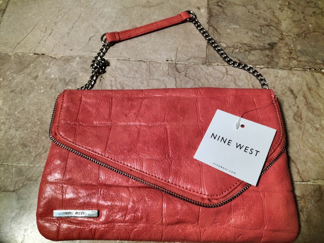 Nine West Shoulder Bag (Category: Shoulder Bags) located in San Pedro. Submitted by adicarteu_ (Listing ID 1237264859, Image 1). Description: WTS Nine West Shoulder Bag • Brand new with tag still intact • Leather material, has one zipper compartment inside MOP: Gcash, BPI Transfer MOD: JnT, LBC, Flash Express.