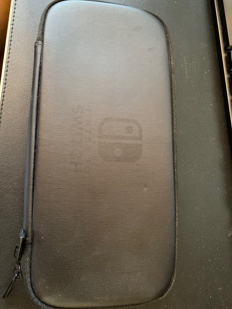 Nintendo Switch Case (Category: Nintendo) located in Singapore. Submitted by peonix (Listing ID 1237184458, Image 1). Description: Original official Nintendo switch case, lightly used..