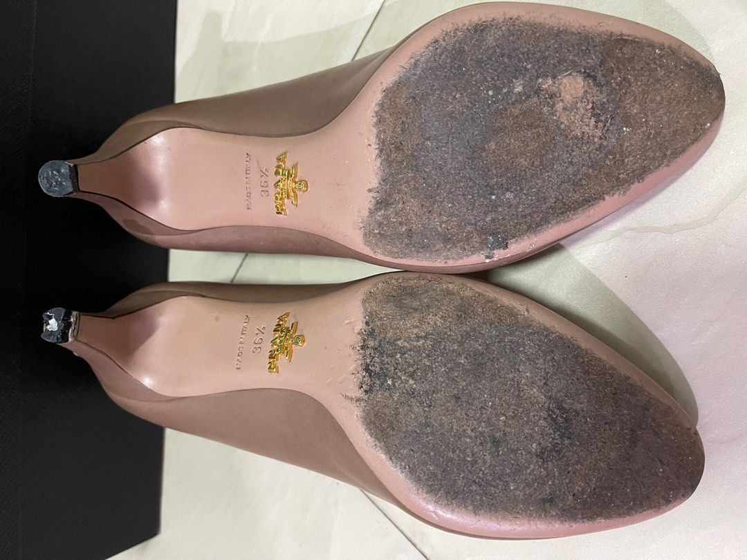 Prada Heels (Category: Heels) located in Singapore. Submitted by elmobubuyier (Listing ID 1237296080, Image 5). Description: Authentic. Made in Italy. Size 36.5 with box. Underutilised. Used for 3 times. Heels require repair (see picture 6). One defect see picture (see picture 4)..