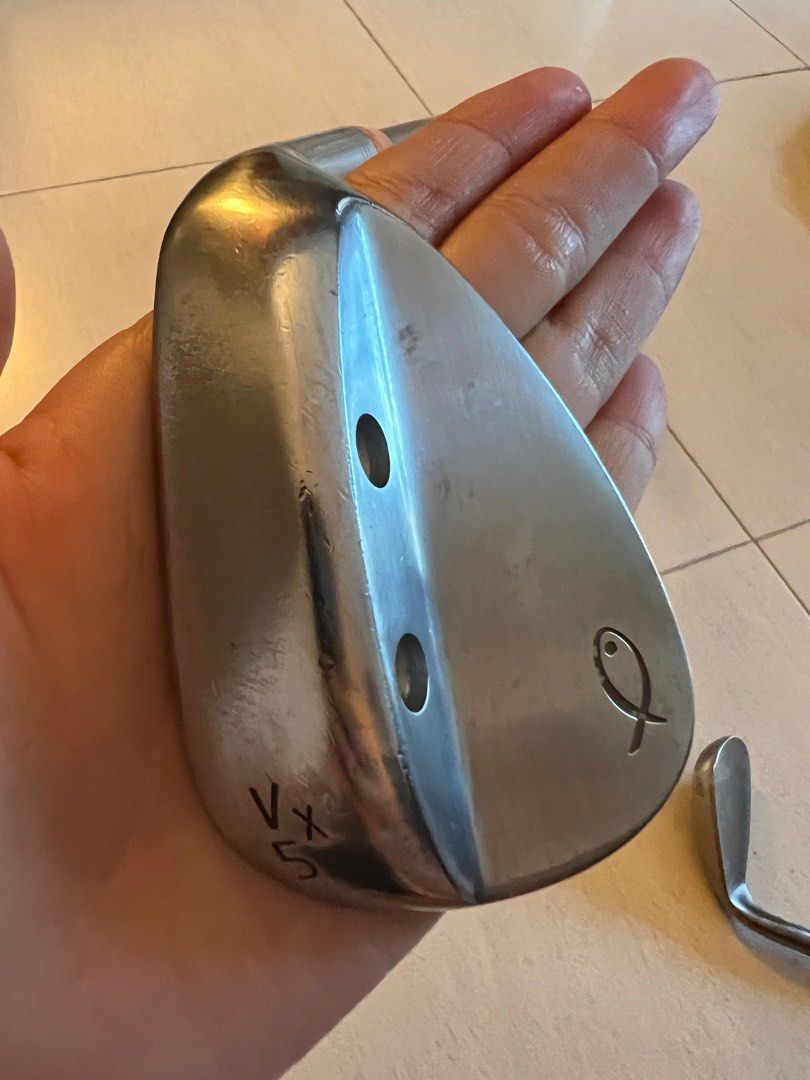 Sand Wedge (Category: Golf) located in Singapore. Submitted by bingpo (Listing ID 1237159964, Image 1). Description: Big Fish 56 Degrees sand wedge Golf pride grip ( blue and Orange) Steel fiber i70 shaft .