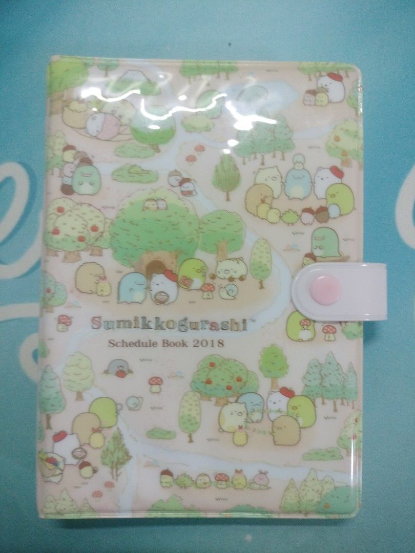 Sumikko Gurashi Official Schedule Book 2018 / Mini Binder Notebook and mini drawstring pouch (Category: Stationery & School Supplies) located in Taytay. Submitted by chukobyninjajaaaan (Listing ID 1237165877, Image 2). Description: With some of the original papers from the schedule book 2018 plus new refill. Still with the pen sleeve (shown on the photos) BAWAL SA MAARTE! The item is pre-loved so manage your expectations. What you see is what you