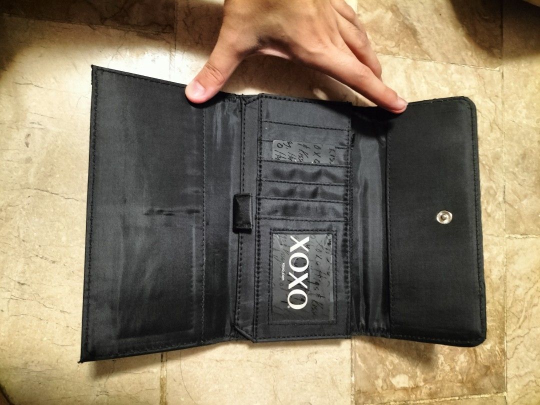 XOXO Tri-fold Wallet (Category: Wallets & Card holders) located in San Pedro. Submitted by adicarteu_ (Listing ID 1237259434, Image 3). Description: WTS XOXO Black Tri-fold Wallet • Brand new with tag, Hardware cover still intact • Comes with XOXO information card MOP: Gcash, BPI Transfer MOD: JnT, LBC, Flash Express.