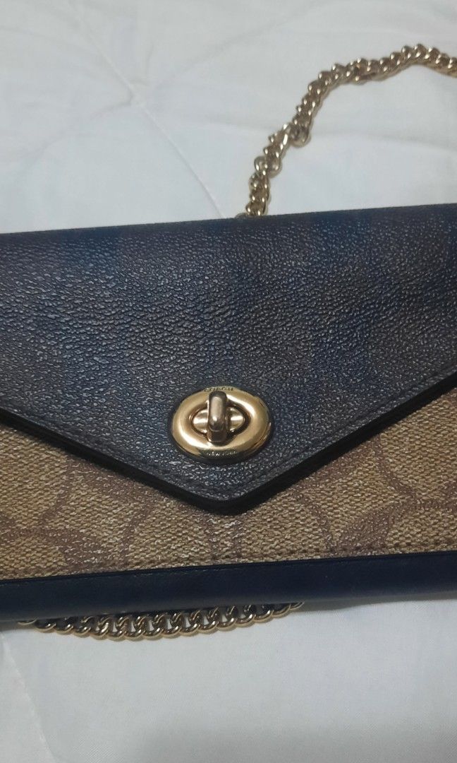 Coach sling wallet on Carousell