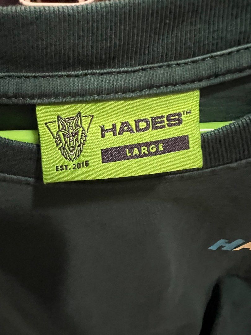 Graphic Tee (Category: Tshirts & Polo Shirts) located in Singapore. Submitted by okaycooool (Listing ID 1237505521, Image 3). Description: Hades Graphic T-Shirt 😎💀 Open to slight negos if fast deal! Discolouration in photo is js the shadow/lighting, no discolouration IRL Only worn once, bought in Vietnam by a local streetwear brand. Super high quality 🤩 Unisex, slightly oversized, fits M-XL. MUs preferred, location can be discussed. Tags: grap
