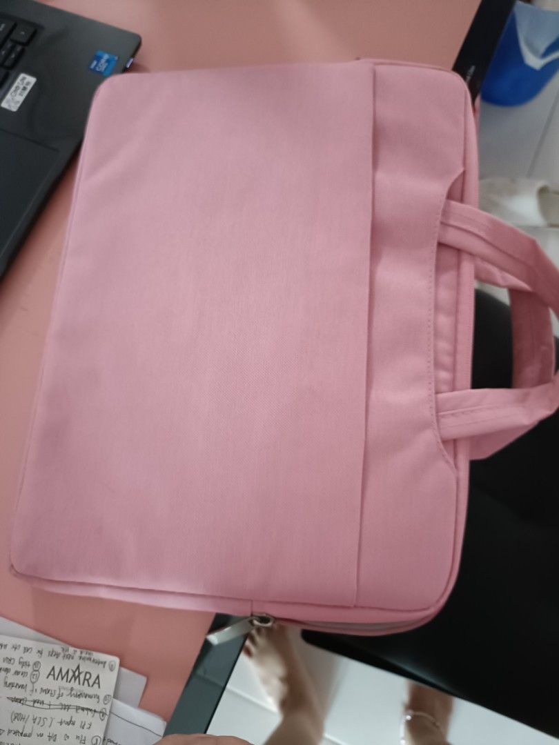 Laptop Bag (Category: Laptop Bags & Sleeves) located in Singapore. Submitted by cgal84 (Listing ID 1237353713, Image 3). Description: never used but kept in storage for very long. good condition. bought wrong size previously hence couldn't use it. Abt 32cm by 25cm. suitable for 13inch and below notebook or tablets. multiple compartments.