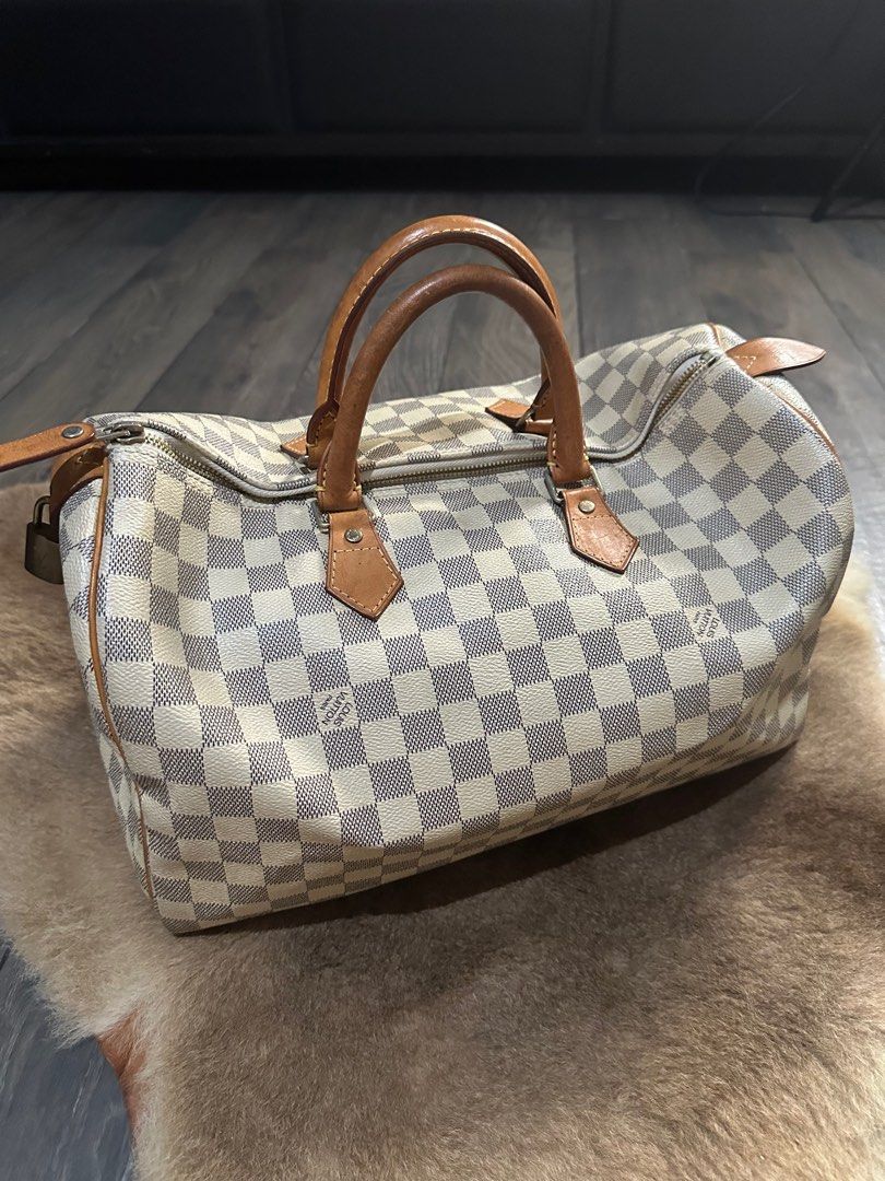 Luis Vuitton Damier Azur Speedy 35 (Category: Luxury Bags & Wallets) located in Taguig. Submitted by theglamhouse (Listing ID 1237407258, Image 1). Description: LV Damier Azur Speedy Bandouliere 30 2017 Collection Good condition with sign of used. Coded.