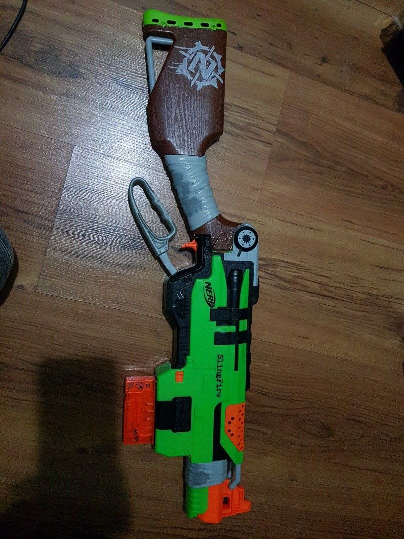 Nerf Slingfire Modded (Category: Action & Battle Toys) located in Singapore. Submitted by plasticlemons (Listing ID 1237689394, Image 1). Description: Modified with larger spring load to shoot further.