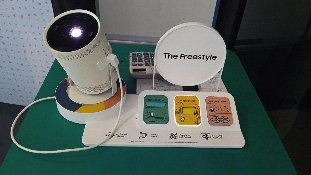 SAMSUNG FREESTYLE PROJECTOR (Category: Projectors) located in Quezon City. Submitted by maryann.dimalanta (Listing ID 1237632982, Image 2). Description: SAMSUNG FULL HD FREESTYLE SMART PROJECTOR * From unboxing to watching in a matter of minutes with Instant Setup * 100" Big Screen experience * Immerse yourself in the middle of the action with Premium 360˚Sound * Discover a world of entertainment with Smart TV Content MODEL SPLSP3BLAXXP SRP 54,99