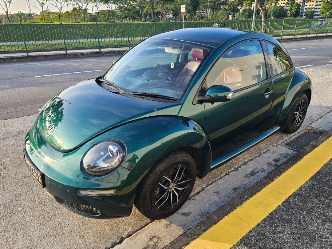Volkswagen New Beetle 1.6 (A) (Category: Used Cars) located in Singapore. Submitted by muttonsoup (Listing ID 1093366608, Image 1). Description: Direct Owner Sale! Out of Production. Resprayed Emerald Green. German VW Beetle 1.6 auto/manual Sports rim Red leather seats Brand New Rear Spoiler Brand New Ceiling lining. Brand New 9" Andriod 12 System 2000x1200 IPS screen Brand New Night Vision Sony 4K 360 degree Camera & 4K AHD Reverse Camera Windpr