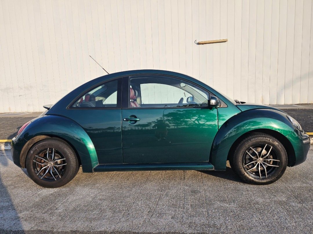 Volkswagen New Beetle 1.6 (A) (Category: Used Cars) located in Singapore. Submitted by muttonsoup (Listing ID 1093366608, Image 2). Description: Direct Owner Sale! Out of Production. Resprayed Emerald Green. German VW Beetle 1.6 auto/manual Sports rim Red leather seats Brand New Rear Spoiler Brand New Ceiling lining. Brand New 9" Andriod 12 System 2000x1200 IPS screen Brand New Night Vision Sony 4K 360 degree Camera & 4K AHD Reverse Camera Windpr