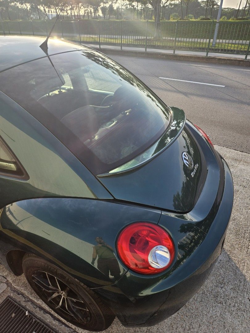 Volkswagen New Beetle 1.6 (A) (Category: Used Cars) located in Singapore. Submitted by muttonsoup (Listing ID 1093366608, Image 3). Description: Direct Owner Sale! Out of Production. Resprayed Emerald Green. German VW Beetle 1.6 auto/manual Sports rim Red leather seats Brand New Rear Spoiler Brand New Ceiling lining. Brand New 9" Andriod 12 System 2000x1200 IPS screen Brand New Night Vision Sony 4K 360 degree Camera & 4K AHD Reverse Camera Windpr