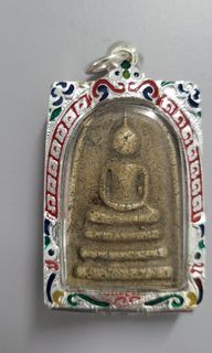 An old amulet, Phra Somdej with new casing.