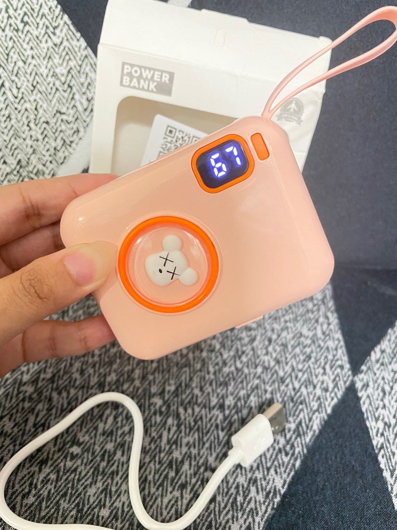 Cartoon Powerbank Pink 10000 (Category: Batteries & Power Banks) located in Makati City. Submitted by cathymars13 (Listing ID 1237827849, Image 3). Description: Just got bought it. For sale for upgrading lang po. Still Nego for sure buyer Additional function: two-way fast charging Applicable type: conventional mobile power supply Cell type: polymer lithium ion cell Shell material: plastic Power capacity: 10000mAh Size: 83 * 64.5 * 25.5mm Charging