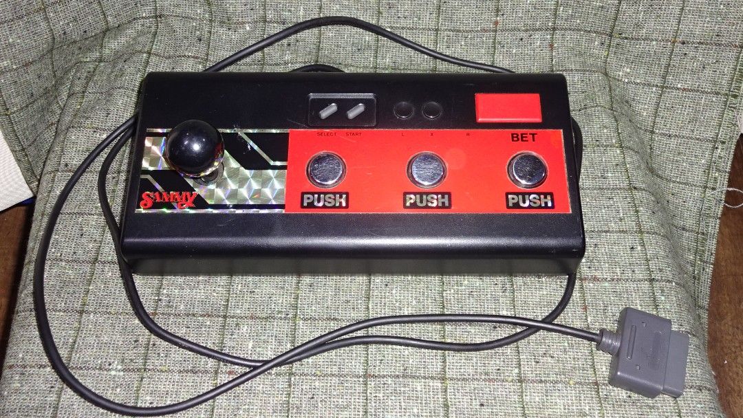 Nintendo Super Famicom Sammy Pachinko Slot Controller (Category: Controllers) located in Paranaque City. Submitted by kutoi.ancheta (Listing ID 1237835289, Image 2). Description: Nintendo Super Famicom Sammy Pachinko Slot Controller Platform: Super Famicom Japan for a variety of Pachinko rom cartridge (excluded) ₱1500 condition: Untested! usual wear and tear! compatibility is buyer's responsibility! as is only! no warranties! pm for inquiries. #n