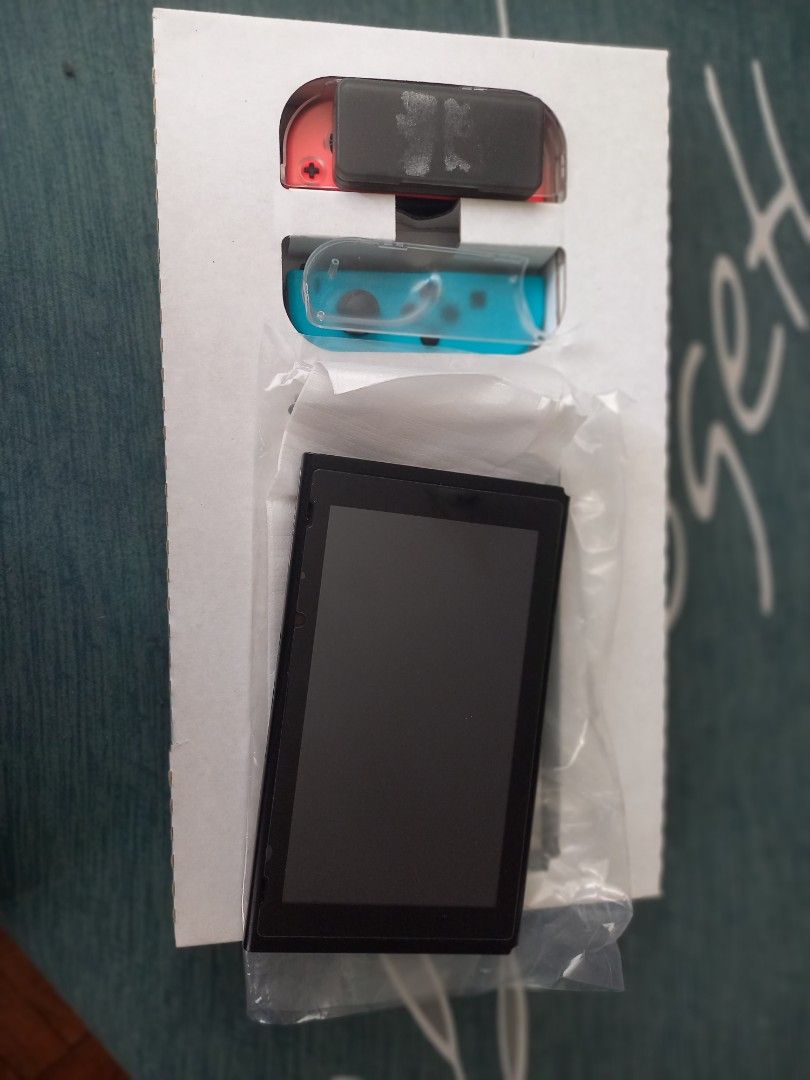 Nintendo switch v1 (Category: Other Gadgets) located in Pasig City. Submitted by cmemo (Listing ID 1237721709, Image 3). Description: can pass as new im not sure if its v1 or v2 complete with 2 joysticks and charger with 2 physical game minecraft and mario odyssey meet up pasig area.