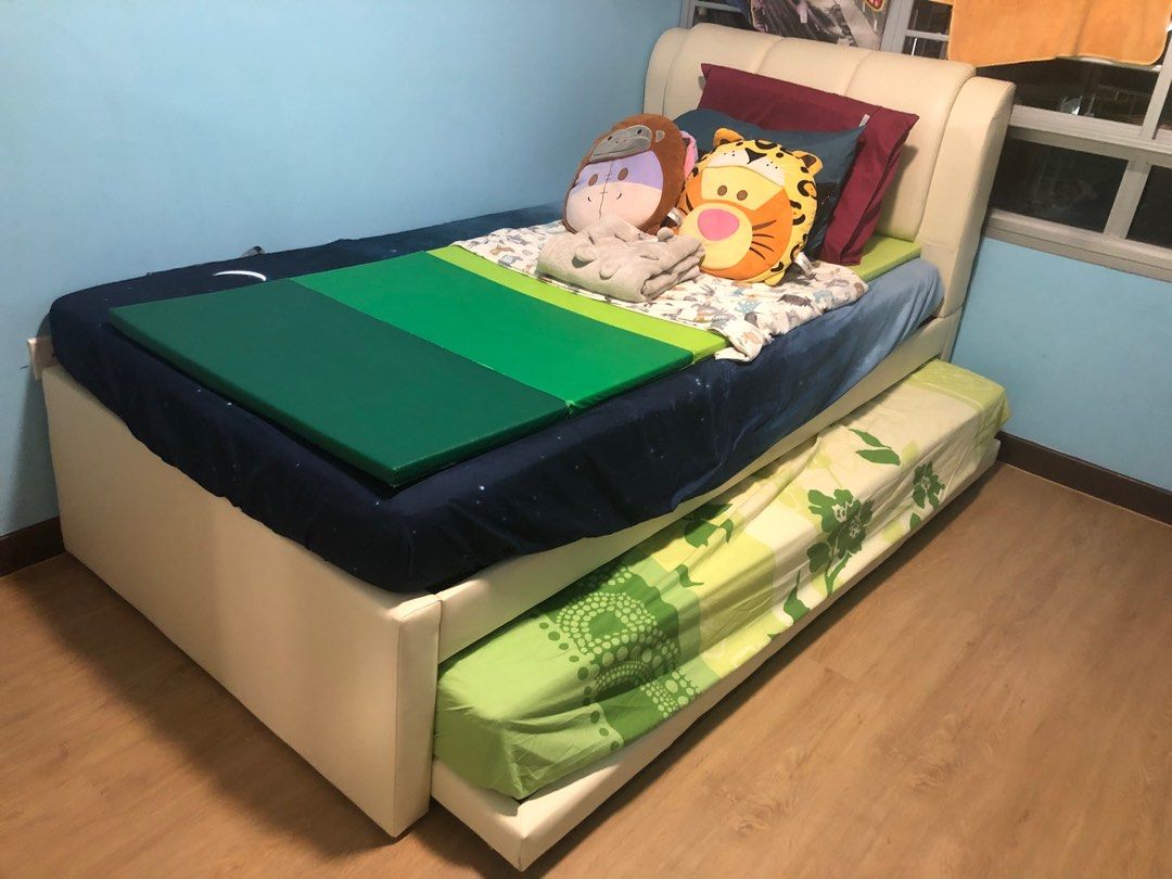 Pull out & up bed (Category: Bed Frames & Mattresses) located in Singapore. Submitted by bellalsree (Listing ID 1237752762, Image 3). Description: Rarely used. Bought it less than 1yr. Used for about 4-5mo by a child. Mattresses covered using waterproof cover and plastic not removed yet though it has torn. Unique: top is super single, bottom single. Open up side by side equals to queen bed. [Top]Super single frame: L 203cm x W 107cm [Bottom]Singl