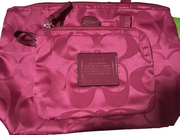 Coach Pink Getaway Weekender Nylon with Pouch (Category: Luxury Bags & Wallets) located in Caloocan City. Submitted by driecloset (Listing ID 1237991857, Image 1). Description: Smaller version of the packable Coach Weekend Getaway Tote ( saw a listing in ebay that this size is rare but im not sure!) *price is negotiable .