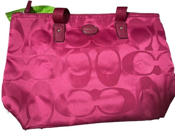 Coach Pink Getaway Weekender Nylon with Pouch (Category: Luxury Bags & Wallets) located in Caloocan City. Submitted by driecloset (Listing ID 1237991857, Image 2). Description: Smaller version of the packable Coach Weekend Getaway Tote ( saw a listing in ebay that this size is rare but im not sure!) *price is negotiable .