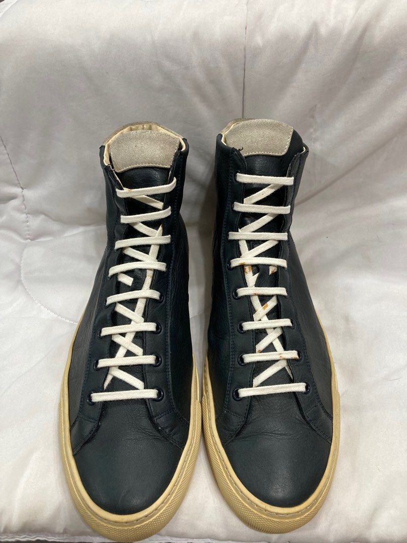 Common Projects Achilles Retro High Navy (Category: Sneakers) located in Baguio. Submitted by lordeidara (Listing ID 1238032843, Image 3). Description: 8/10 Sole Drags Yellowing Soles Rust Stains on the Laces No Box Color: Navy Blue Material: Leather Size on Tag: 44 Fits size: 11 US mens.