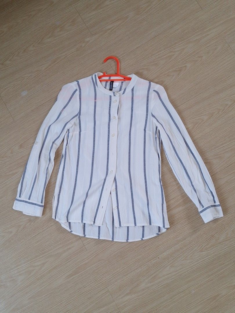 H&M White Vertical Stripes longsleeve blouse (Category: Blouses) located in San Pedro. Submitted by recitea (Listing ID 1237997517, Image 1). Description: I am selling my preloved vertical stripes longsleeve H&M blouse. Used but not abused. A good officewear blouse and goes well with Khakis, maong pants, shorts and skirt. Very comfortable to wear. RFS: Decluttering, need to let go of some longsleeves. Brand: DIVIDED by H&M Size: EUR : 32 US : 2 C
