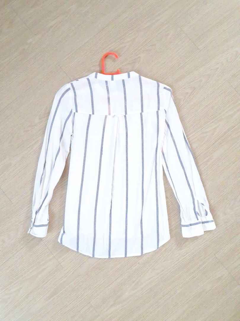 H&M White Vertical Stripes longsleeve blouse (Category: Blouses) located in San Pedro. Submitted by recitea (Listing ID 1237997517, Image 2). Description: I am selling my preloved vertical stripes longsleeve H&M blouse. Used but not abused. A good officewear blouse and goes well with Khakis, maong pants, shorts and skirt. Very comfortable to wear. RFS: Decluttering, need to let go of some longsleeves. Brand: DIVIDED by H&M Size: EUR : 32 US : 2 C