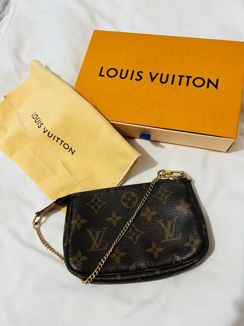 RUSH LV Mini Pochette (Category: Luxury Bags & Wallets) located in Subic. Submitted by luxbytasha (Listing ID 1221122490, Image 1). Description: - Authentic Louis Vuitton Monogram Pouch - Includes original Louis Vuitton box and dust bag - Features elegant gold chain detail - Perfect for carrying essentials - Versatile for a night out or organizing a larger bag Disclaimer: @luxbytasha is not affiliated or endorsed with any of the brands featured o