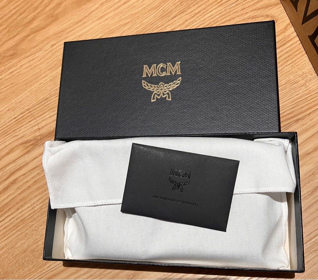 MCM Lanyard Phone Case (Category: Luxury Bags & Wallets) located in Taytay. Submitted by becha1 (Listing ID 1237972579, Image 3). Description: Complete with box, cloth and paperbag.