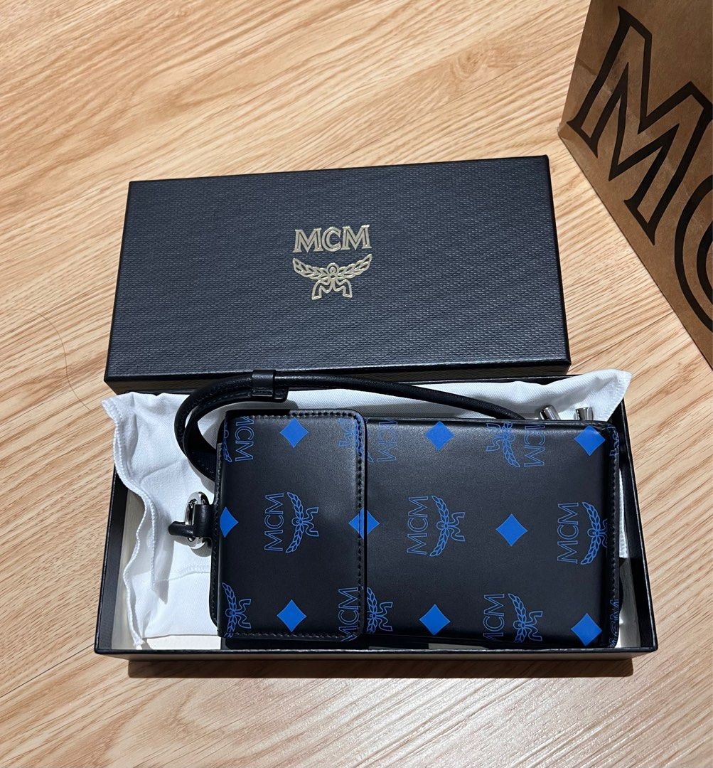 MCM Lanyard Phone Case (Category: Luxury Bags & Wallets) located in Taytay. Submitted by becha1 (Listing ID 1237972579, Image 2). Description: Complete with box, cloth and paperbag.