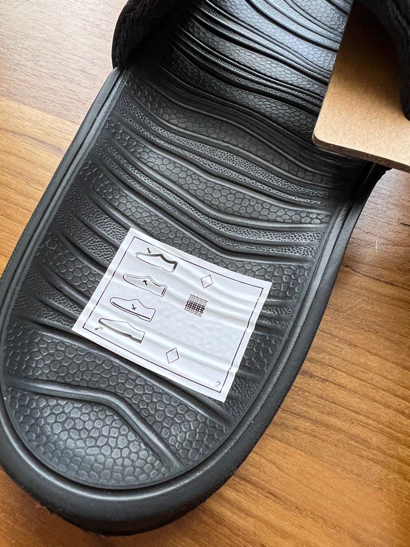 Nike slippers junior online