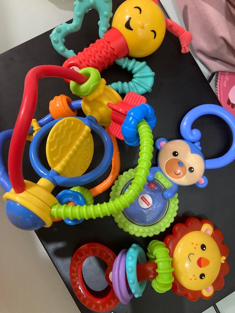 Various Rattles two with teether function (Category: Infant Playtime) located in San Juan City. Submitted by truewater.84aefe (Listing ID 1238000581, Image 1). Description: Fisher price, and other branded from toysrus.