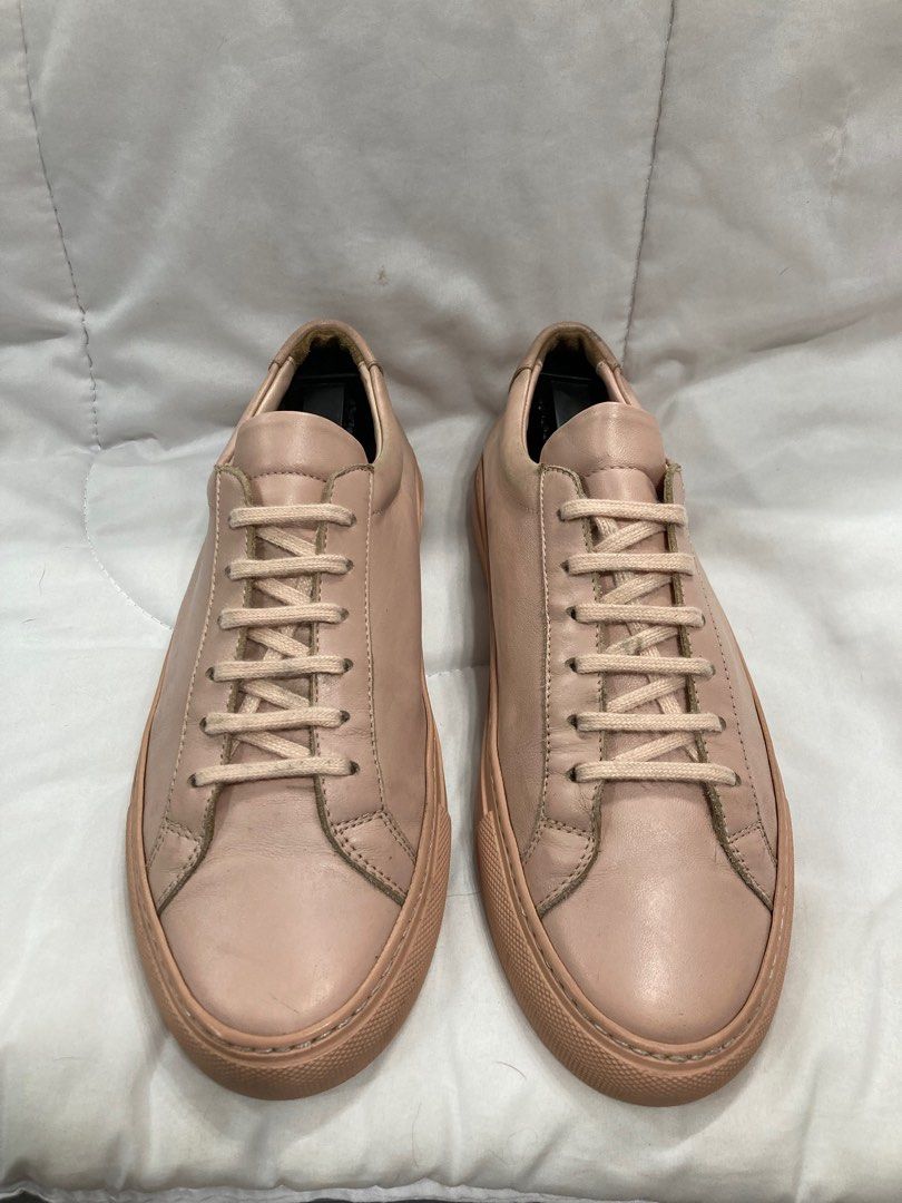 Woman by Common Projects Achilles Low Blush (Category: Sneakers) located in Baguio. Submitted by lordeidara (Listing ID 1238032417, Image 3). Description: 8/10 Has scuffs, scratches, aging soles, and sole drags. No Box Color: Blush Material: Leather Size on Tag: 39 Fits size: 7.5 US womens.