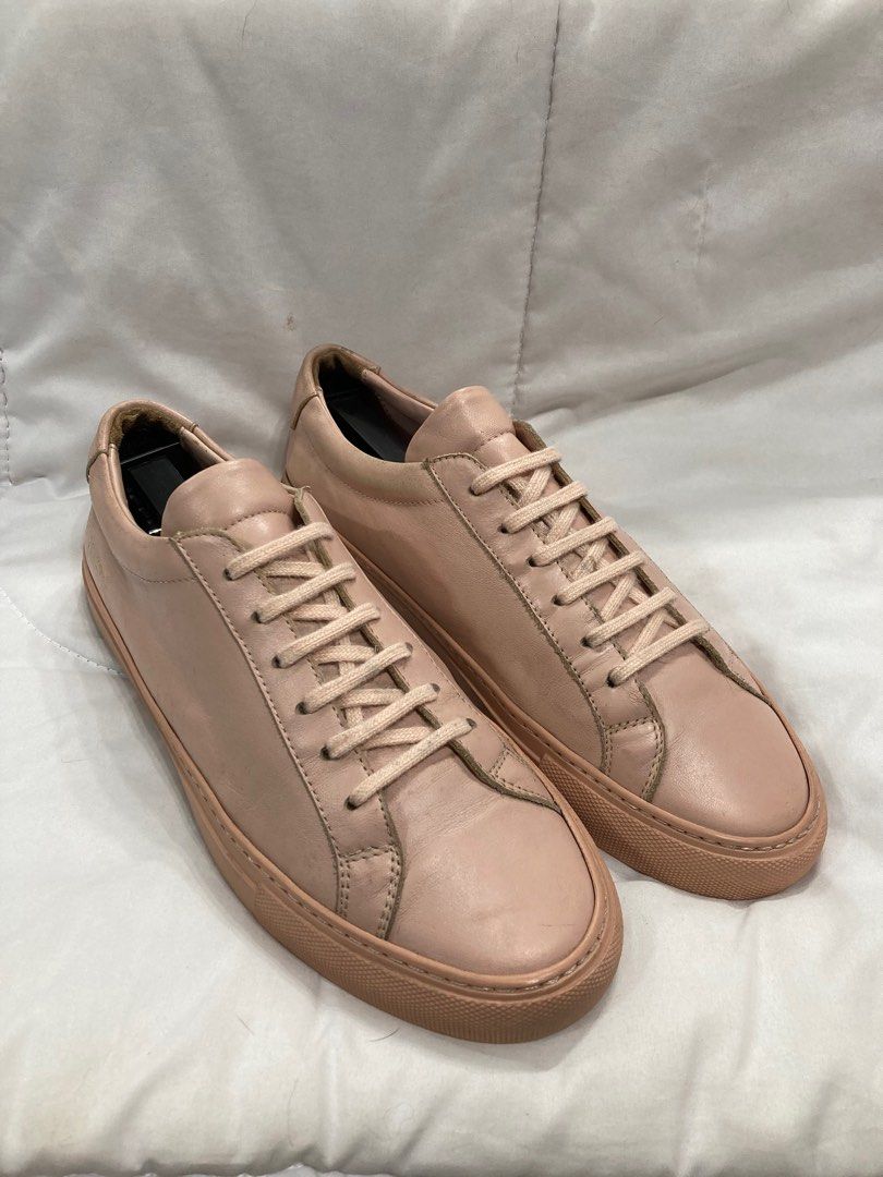 Woman by Common Projects Achilles Low Blush (Category: Sneakers) located in Baguio. Submitted by lordeidara (Listing ID 1238032417, Image 2). Description: 8/10 Has scuffs, scratches, aging soles, and sole drags. No Box Color: Blush Material: Leather Size on Tag: 39 Fits size: 7.5 US womens.