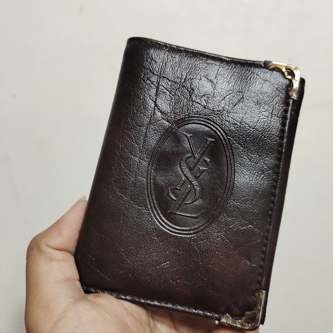 YSL Bifold Leather Wallet (Category: Luxury Bags & Wallets) located in Baguio. Submitted by PreiLoveMaria (Listing ID 1238020362, Image 1). Description: YSL Bifold Leather Wallet Good used condition Signs of wear Kindly refer to the last photo Check detailed photos Shipping via J&T only No COD/COP Pls, manage expectations since this item is from Japan Surplus..