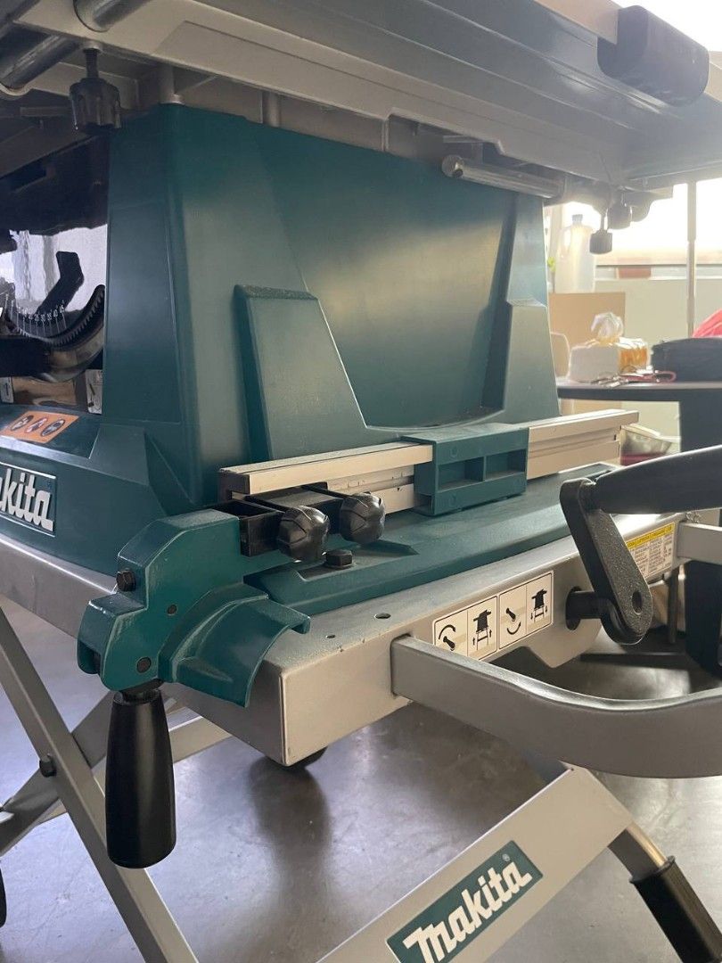Makita MLT100 table saw with roller stand, Furniture & Home Living