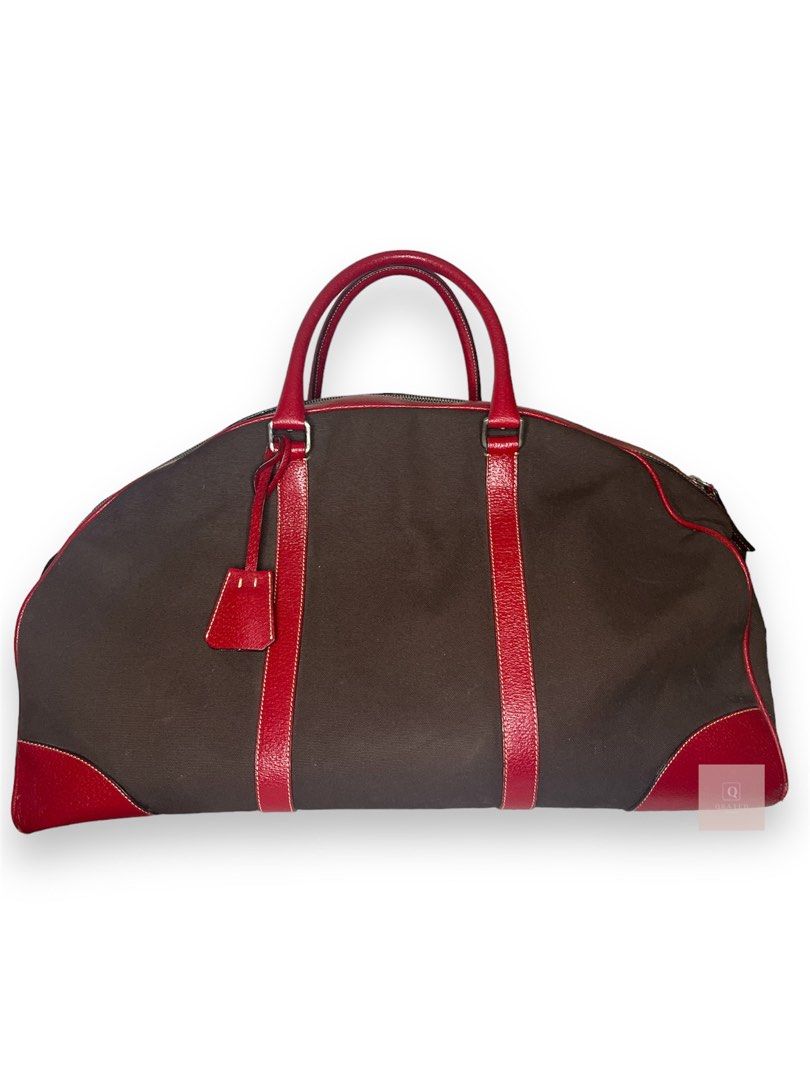 Prada handbag luggage (Category: Luxury Bags & Wallets) located in Manila. Submitted by Qratedph.pieces (Listing ID 1238107562, Image 3). Description: Prada handbag luggage Rank AB, rubs on corners, white removeable stains With key, bag tag Php 15,200 *color may vary due to lighting Disclaimer: Qratedph.pieces is not associated or affiliated with the brands featured. All copyrights and trademarks reserved to brand owners..