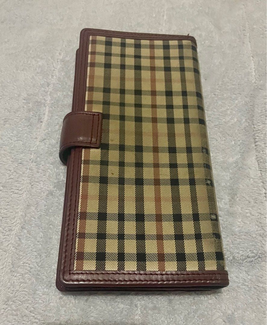 Daks trifold long wallet (Category: Luxury Bags & Wallets) located in San Pablo. Submitted by prelovedbymistyblue (Listing ID 1238384031, Image 2). Description: Super nice trifold Daks wallet. Has many compartment and card slots. Made up of canvass and leather. Main flaw: some ink stain and some dirt and fading on the canvass of the wallet. Minimal rub on the right side of card holder. Selling low for 600. .