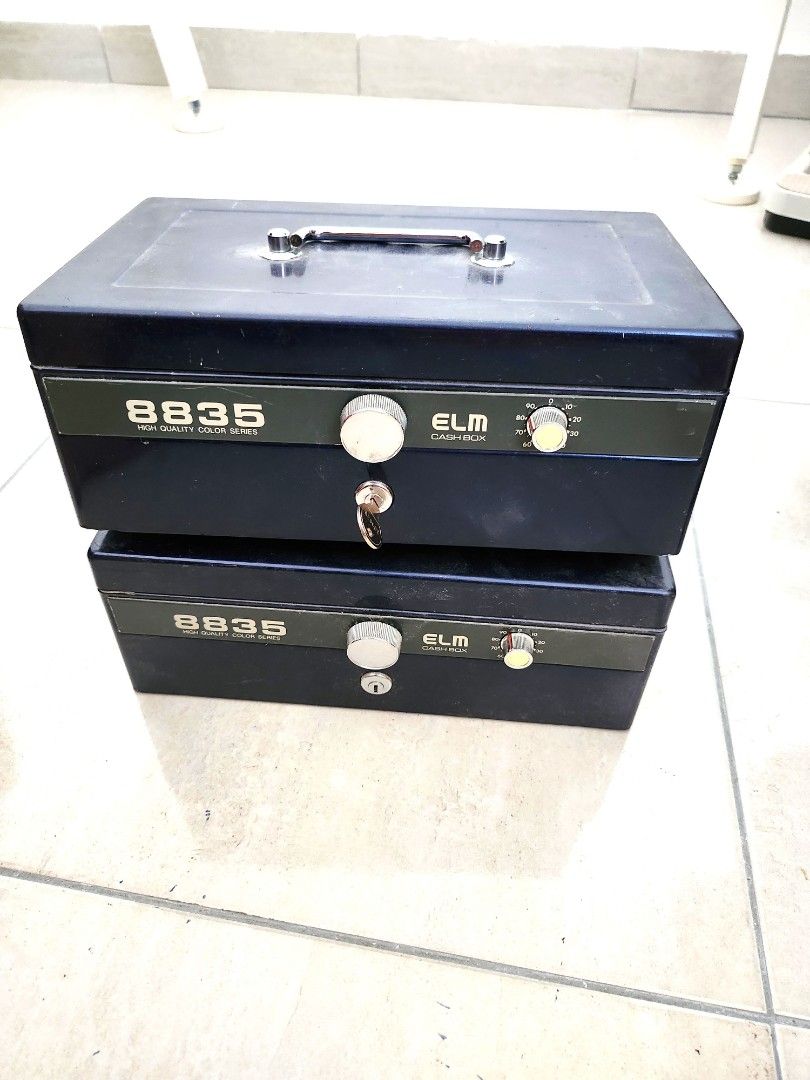 ELM Cashbox 8835 (Qty: 2 units, Color: Blue) (Category: Safe) located in Puchong. Submitted by ella_garage_sale (Listing ID 1238321533, Image 1). Description: ELM Cashbox 8835 Good condition. 1 box with key, 1 box no key. Qty: 2 units for RM120. Original price RM200 each. Color: Blue Model 8835 ELM High quality cash box to store valuables. Cash box with key lock and dial system. Banknote slot available inside. Measurement in MM: 279 x 179 x 118mm