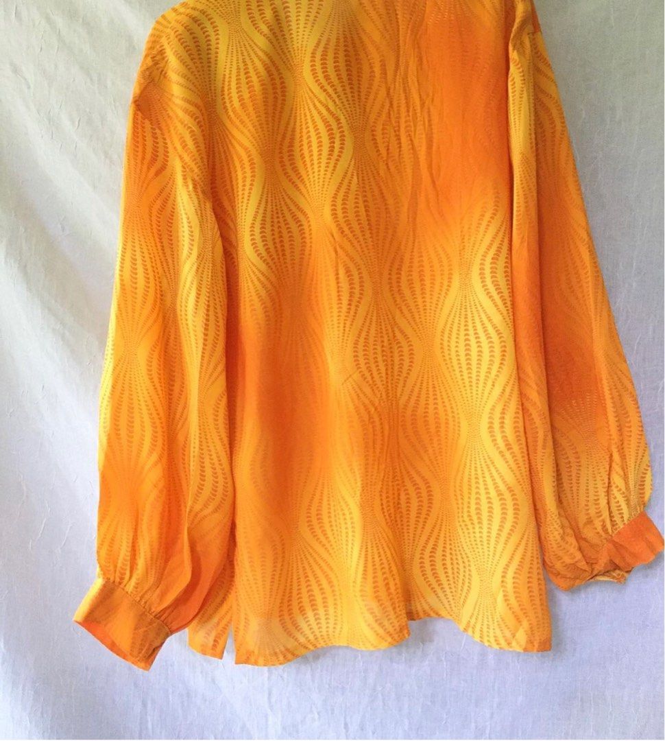 retro 70s-inspired print sheer orange button shirt on Carousell