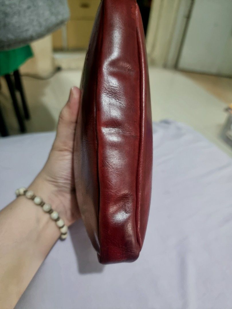 Chateau De Versailles Paris Pochette (Category: Luxury Bags & Wallets) located in Rizal. Submitted by roccini (Listing ID 1235202955, Image 3). Description: Chateau De Versailles Paris Pochette Magenta Leather Bag Zip closure Leather Puller Intact No tarnish on its hardwares With Japanese sticker at the back part of the leather handle Leather handle could be extended to sling, or they can put on additional sling with clasp on both sides Shown the