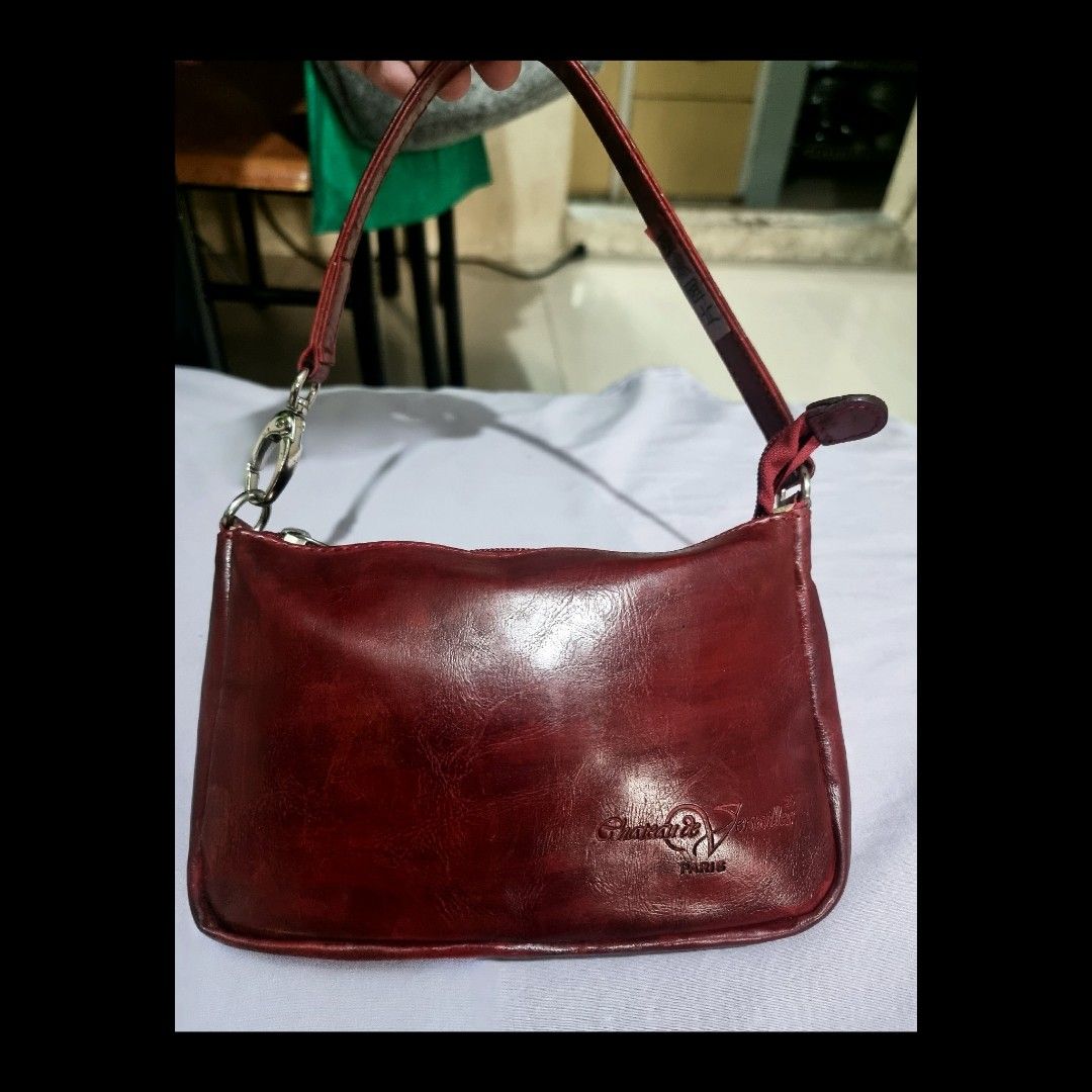 Chateau De Versailles Paris Pochette (Category: Luxury Bags & Wallets) located in Rizal. Submitted by roccini (Listing ID 1235202955, Image 1). Description: Chateau De Versailles Paris Pochette Magenta Leather Bag Zip closure Leather Puller Intact No tarnish on its hardwares With Japanese sticker at the back part of the leather handle Leather handle could be extended to sling, or they can put on additional sling with clasp on both sides Shown the