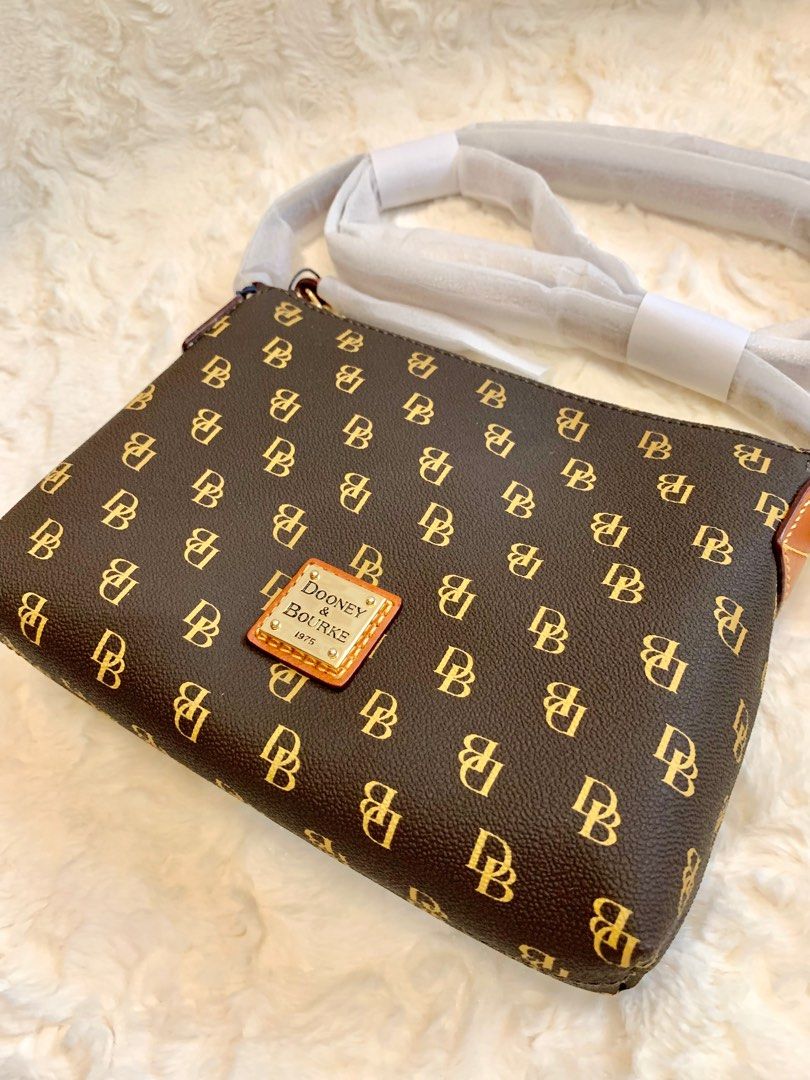 Dooney and Bourke Cross body bag (Category: Cross-body Bags) located in San Fernando. Submitted by sheydm18 (Listing ID 1235217346, Image 2). Description: Guaranteed Original Brand new Fits cellphone, wallet, powder, keys. Best On-the-Go bag! ❤️ Shipping c/o buyer available for Shopee checkout (COD for shipping only).