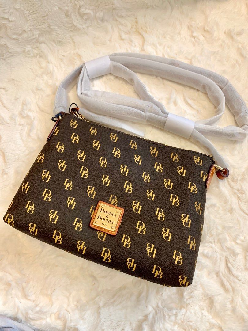 Dooney and Bourke Cross body bag (Category: Cross-body Bags) located in San Fernando. Submitted by sheydm18 (Listing ID 1235217346, Image 1). Description: Guaranteed Original Brand new Fits cellphone, wallet, powder, keys. Best On-the-Go bag! ❤️ Shipping c/o buyer available for Shopee checkout (COD for shipping only).