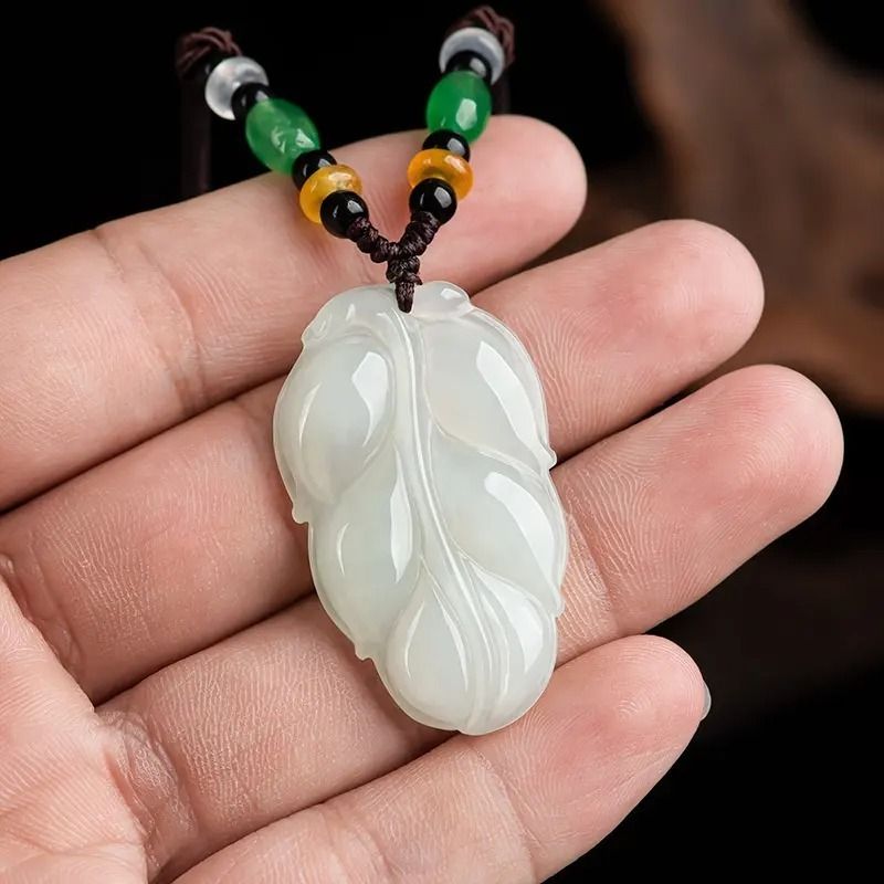 Carved top jadeite pendant